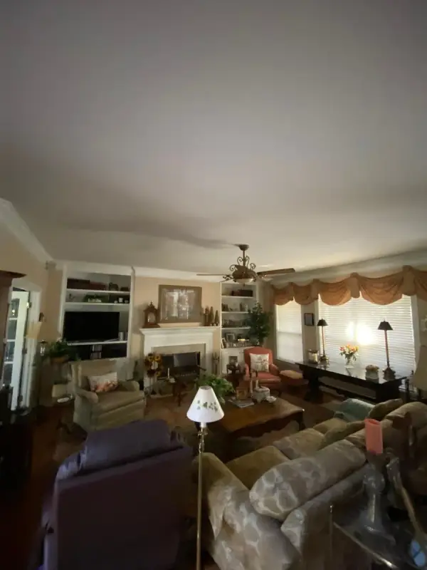 Living room with built-in shelves and white mantel, Belle Meade, TN