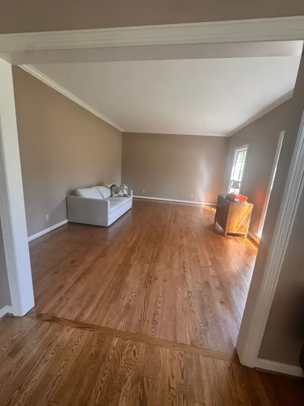 Taupe living room with white crown and baseboards, Bellevue, TN