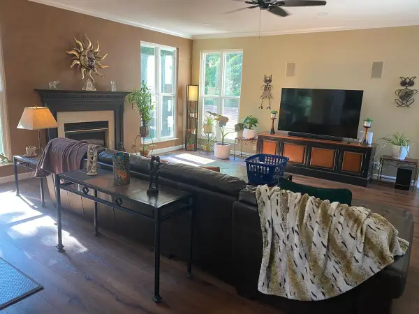 Tan living room with fireplace and white crown, Bellevue, TN