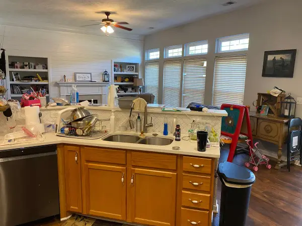 Kitchen and family room with tan walls and white shelves, Bellevue, TN