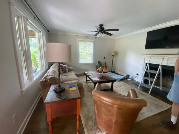 Living room with white fireplace surround and windows, Fairview, TN