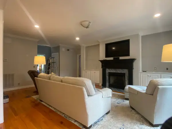 Family room with gray walls, black mantel and white crown, Franklin, TN