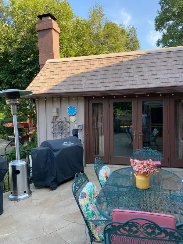 Gray siding and French doors behind a patio table, Franklin, TN