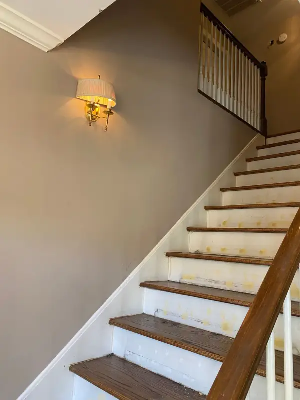 Stair risers spot-filled beside a taupe wall, Bellevue, TN