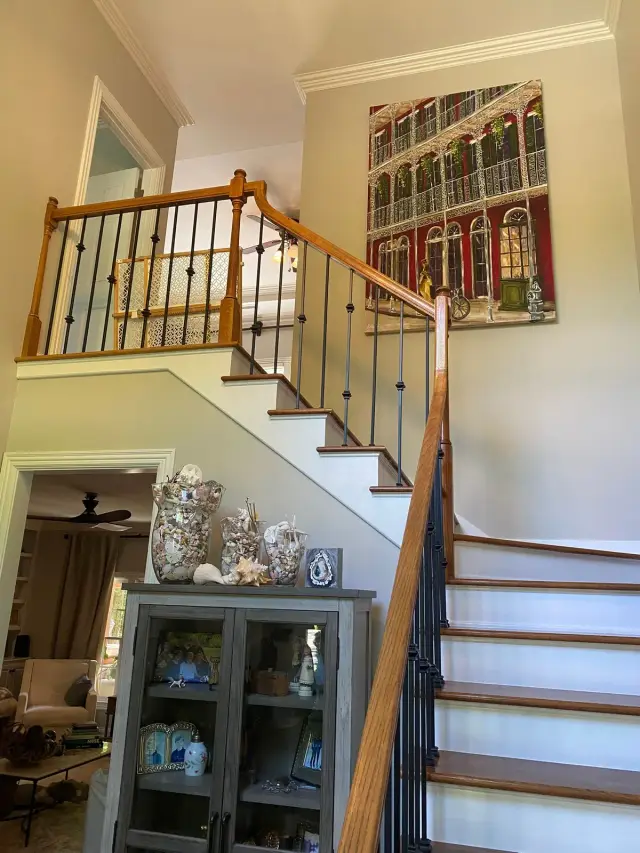 Staircase with wrought-iron balusters, oak rail and white risers, Brentwood, TN