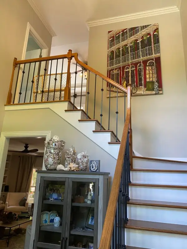Staircase with wrought-iron balusters, oak rail and white risers, Brentwood, TN
