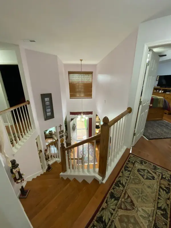 Upstairs landing with white spindles and pale walls, Brentwood, TN