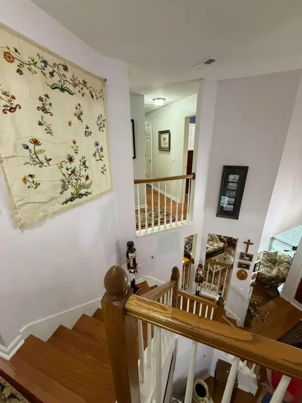 Stair landing with oak rail and pale walls, Brentwood, TN