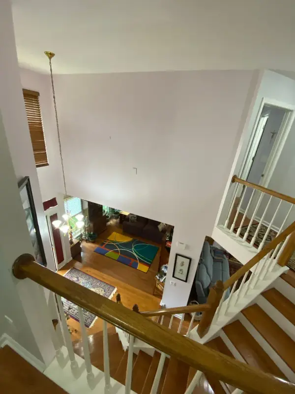 Stair from above with white spindles and oak rail, Brentwood, TN
