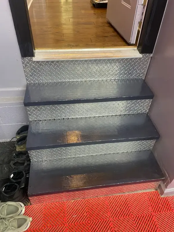 Short flight of dark painted steps with diamond-plate risers, Franklin, TN