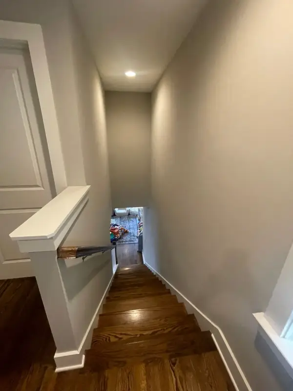 Stairwell down from a white half-wall cap and gray walls, The Nations, Nashville, TN