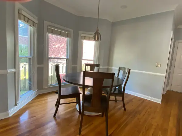 Breakfast nook with white chair rail under tall windows, Franklin, TN