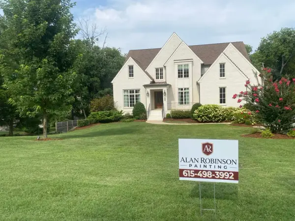 White brick house front with an Alan Robinson Painting yard sign, Belle Meade, TN