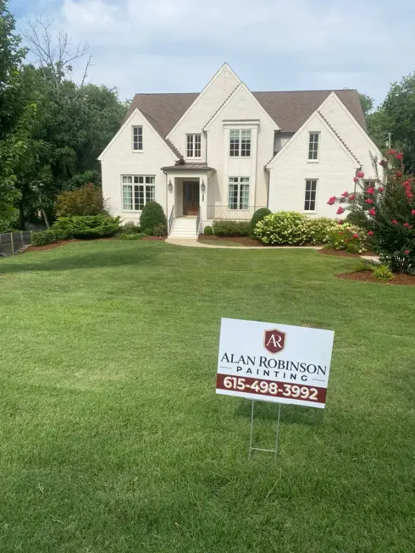 White brick two-story house with a yard sign on the lawn, Belle Meade, TN