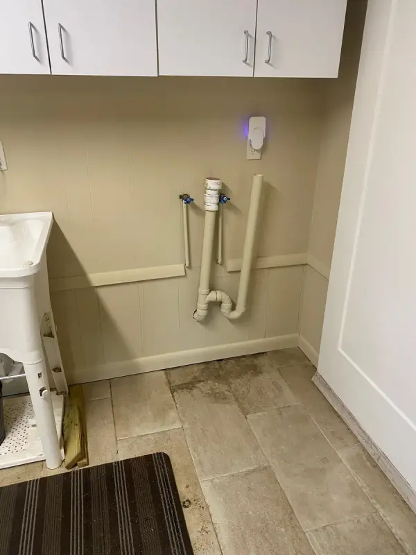 Laundry room finished in warm beige with white chair rail, Bellevue, TN