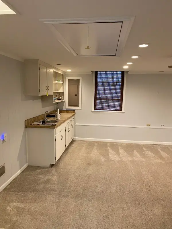 Basement kitchenette with light gray walls and white trim, Bellevue, TN