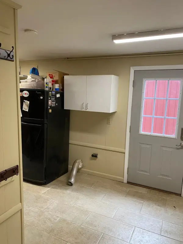 Mudroom with beige walls and a gray exterior door, Bellevue, TN