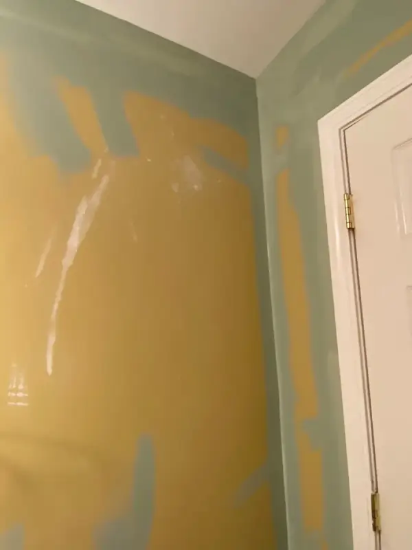 Wall half painted, green over mustard yellow, Bellevue, TN