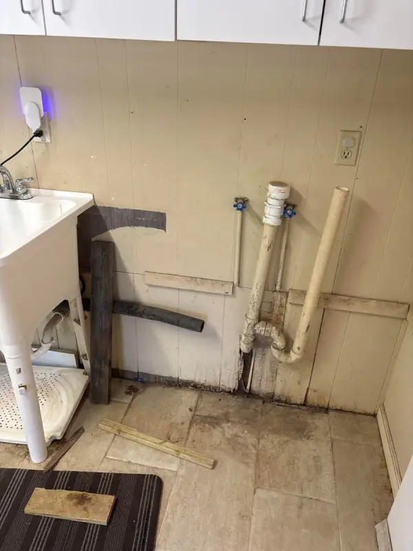 Laundry room wall opened up around exposed pipes, Bellevue, TN