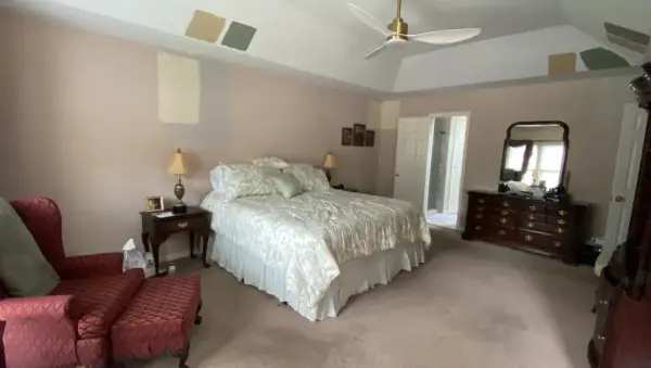 Bedroom with paint color samples brushed on walls and tray ceiling, Bellevue, TN