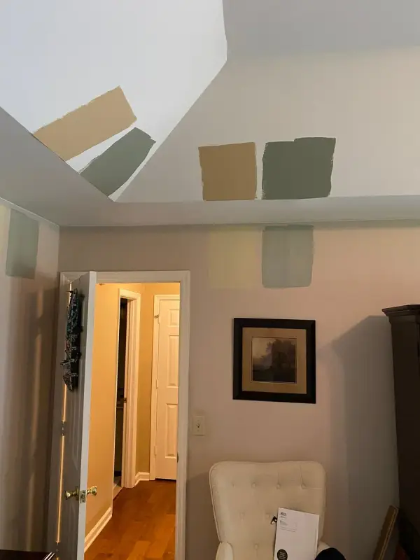 Tan and sage paint samples on a wall beside a doorway, Bellevue, TN