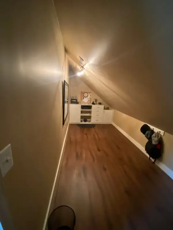 Tan bonus room under a sloped ceiling, Bellevue, TN