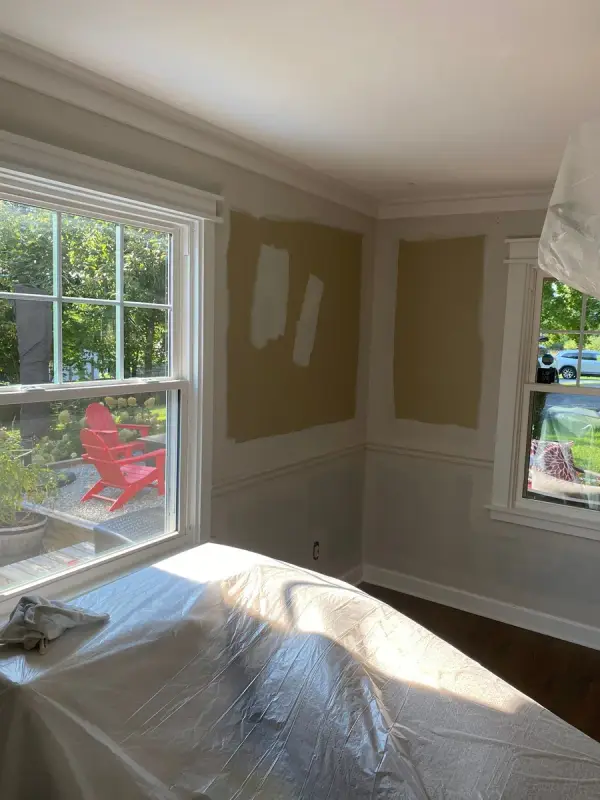 Tan walls spotted with patching compound above white chair rail, Fairview, TN