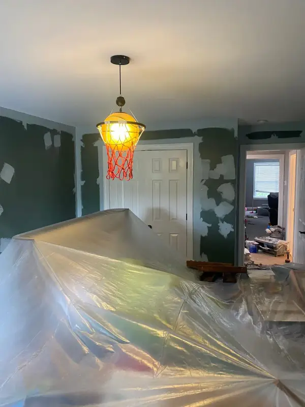 Spot-patched green walls with the room covered in plastic, Franklin, TN