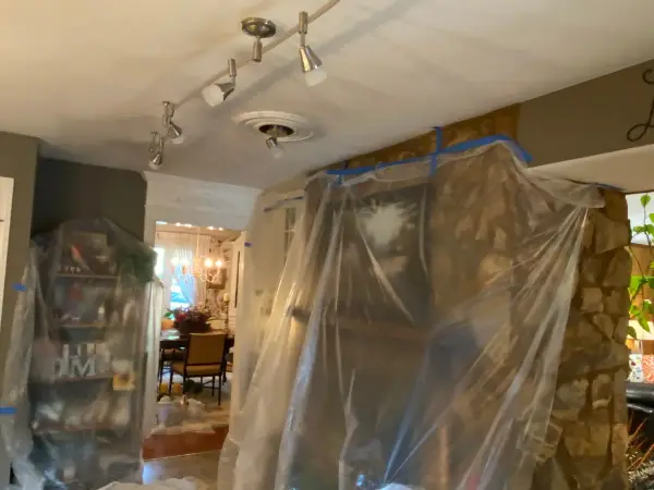 Room opening sealed in plastic beside a stone column, Franklin, TN