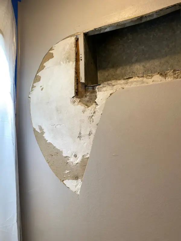 Wall opened around a vent with patching compound, Franklin, TN