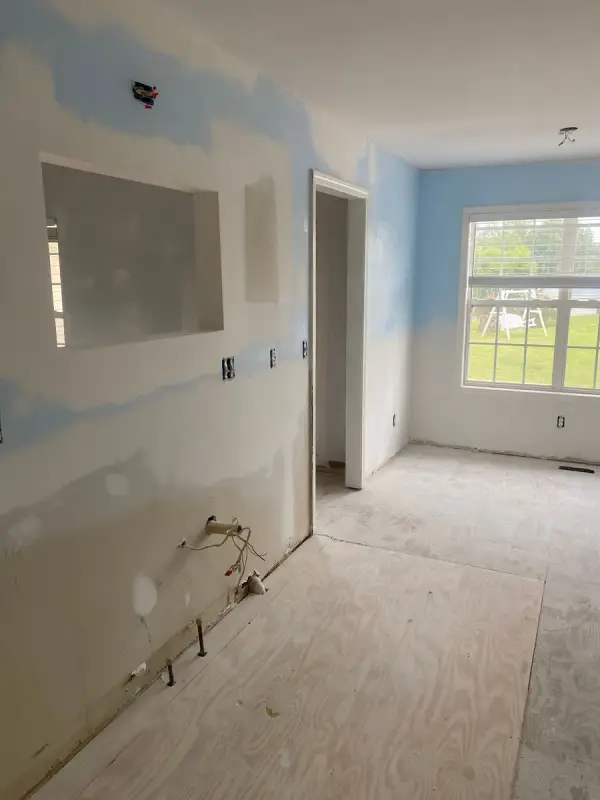 Blue walls partly covered with white primer, Pleasant View, TN