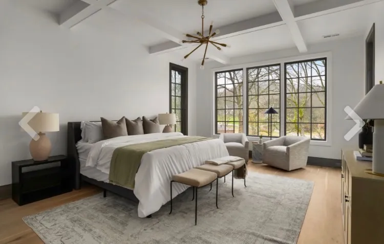 Bedroom with fresh white walls, a coffered ceiling and black-framed windows, the kind of detail that shapes a Bellevue interior painting estimate