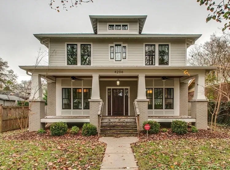 Foursquare home with painted lap siding, white trim and tapered porch columns, part of the exterior painting we do for Belle Meade homes