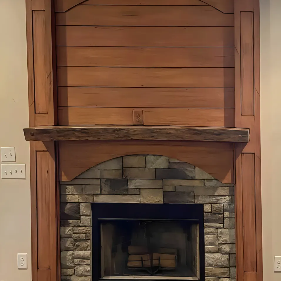 Hand-finished reclaimed-wood and stone fireplace surround, interior painting by hand for Bellevue homes