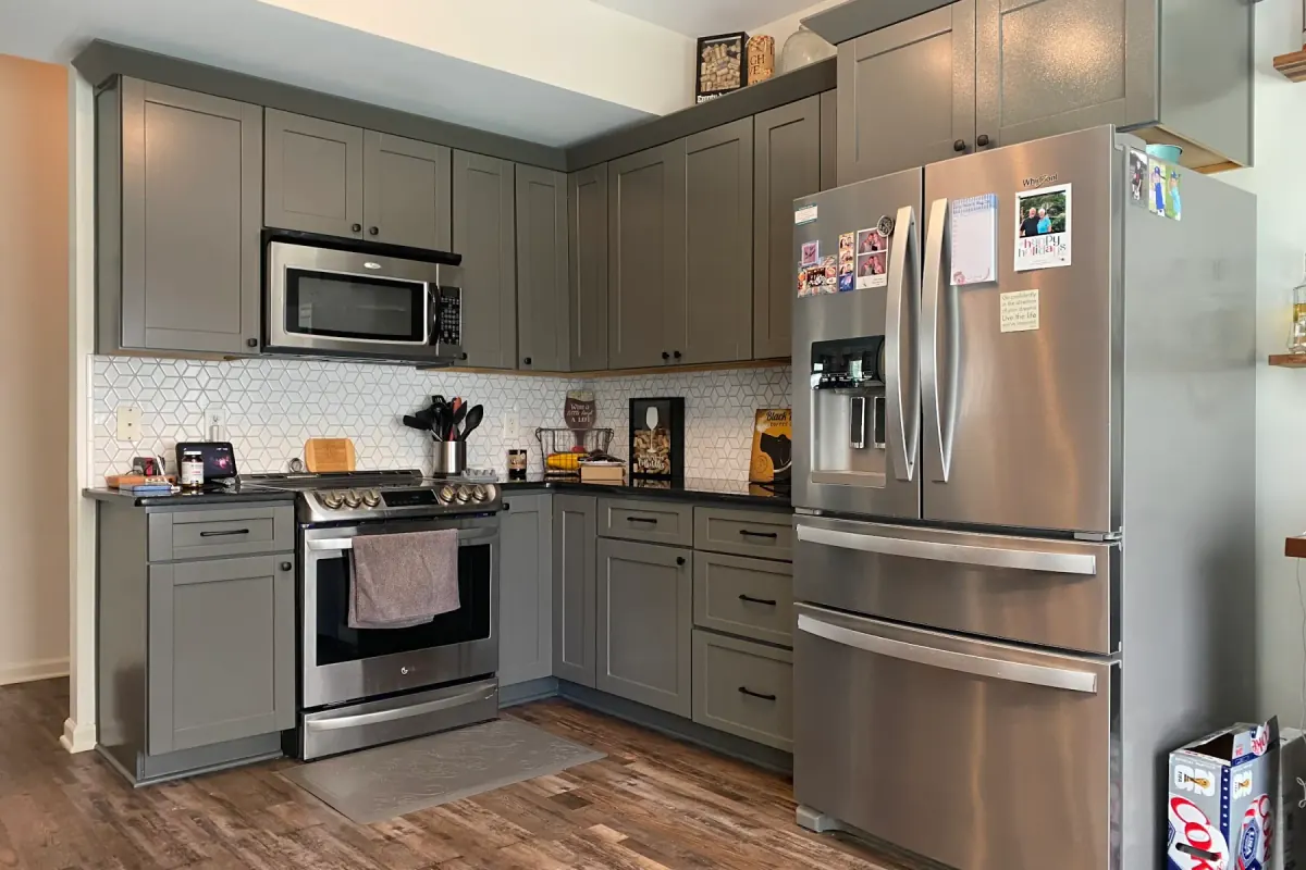 Gray shaker kitchen cabinets with a sprayed, factory-smooth finish, a step in our cabinet painting process for Bellevue homes