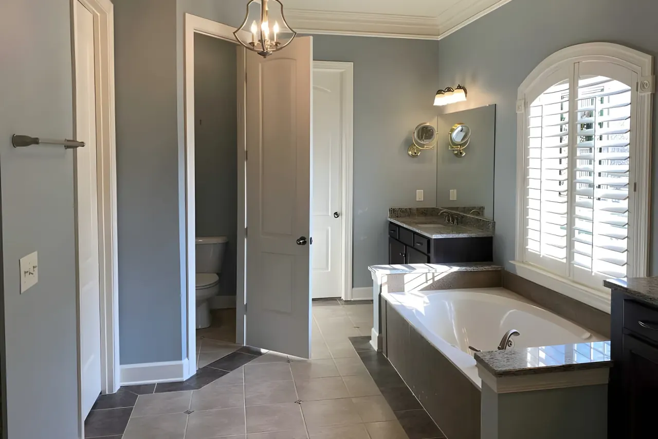 Primary bath with soft gray walls, white crown molding and straight ceiling lines, the kind of detail that shapes a Bellevue interior painting estimate