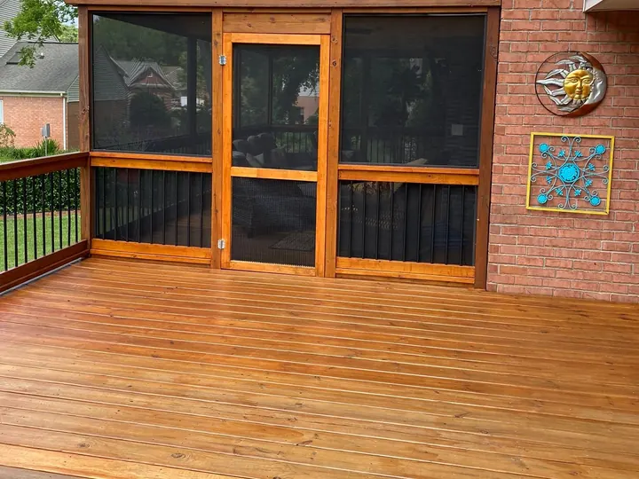 Pergola-topped screened porch stained cedar beside a brick wall, over a stained deck, exterior wood staining for a Brentwood home