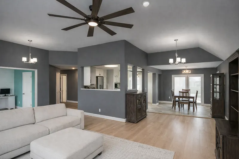 Gray living room with crisp white trim and ceiling breaks by Alan Robinson Painting