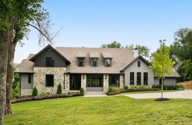 Luxury Nashville home with painted stone and dark trim accents