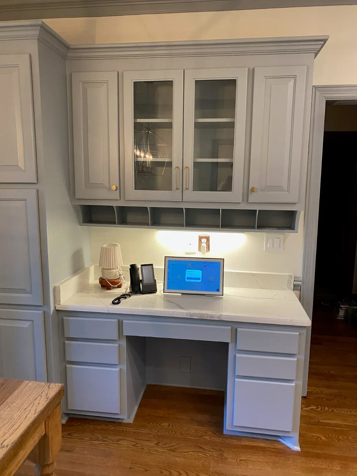 Abigail W.'s gray-painted built-in kitchen desk, one of our cabinet painting projects for Brentwood homes