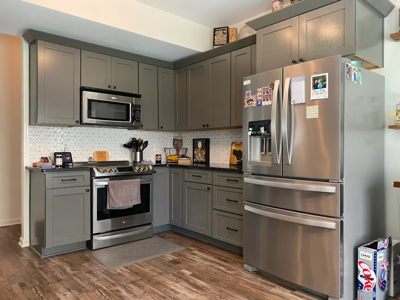 Barbara K.'s kitchen cabinets, painted a warm gray, part of the cabinet painting we do for Bellevue homes