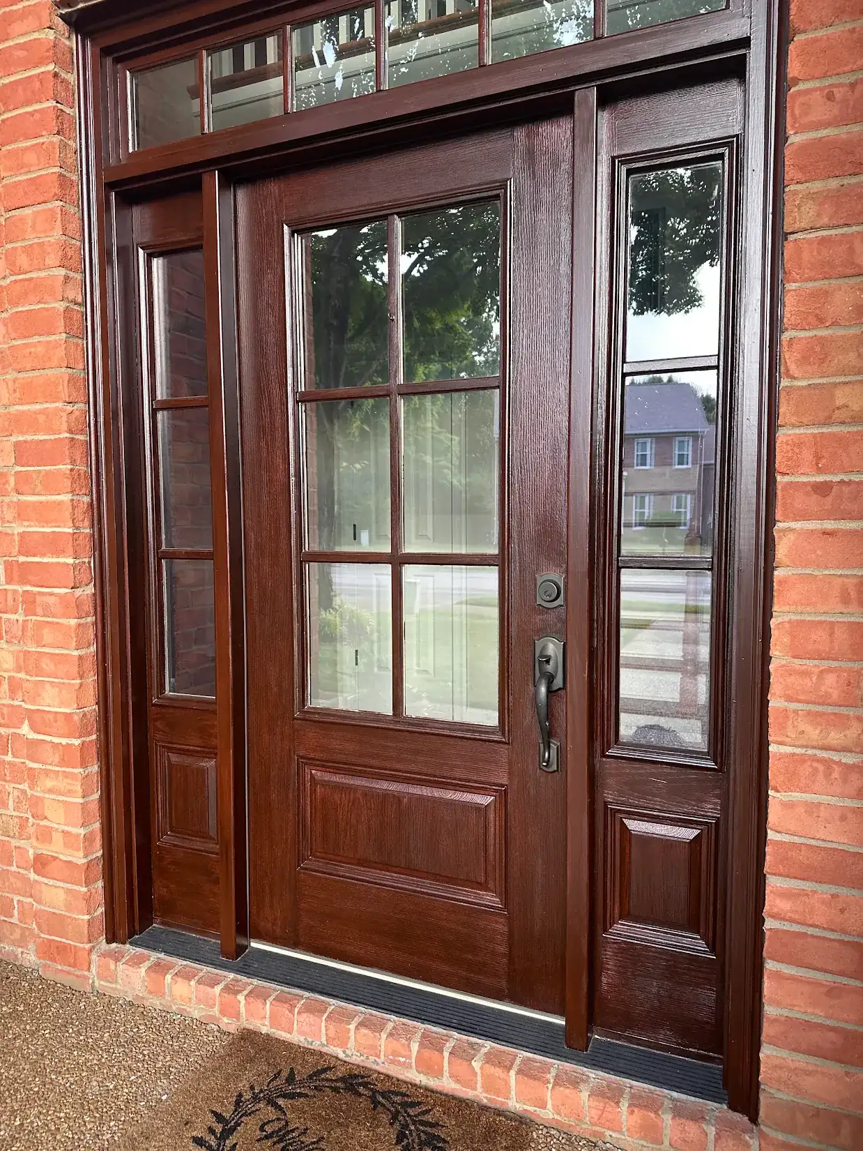 Pop R.'s front door refinished in a deep stain, part of the exterior painting we do for Belle Meade homes