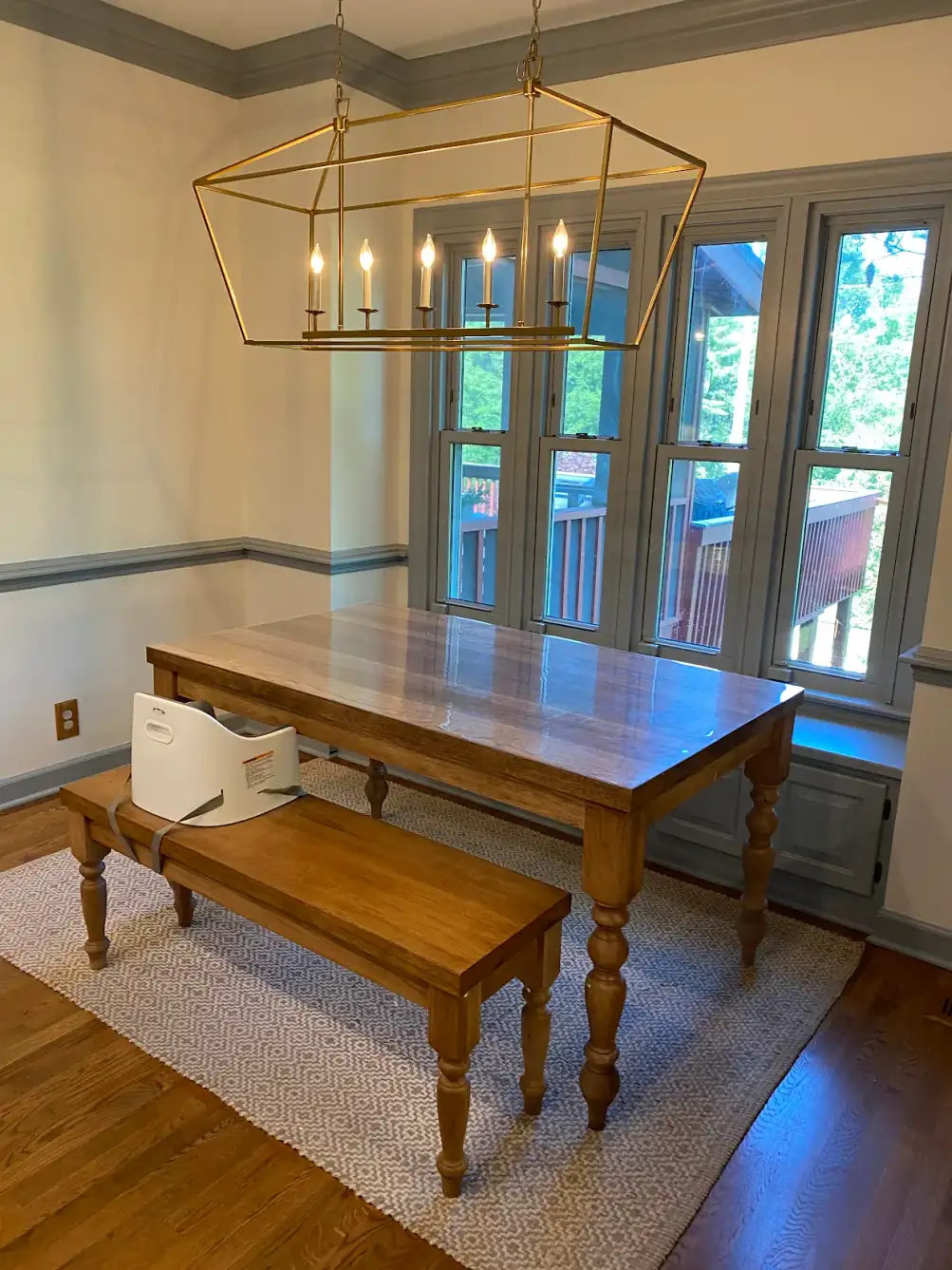 Abigail W.'s dining room with fresh paint above a white chair rail, a customer photo from a Google review