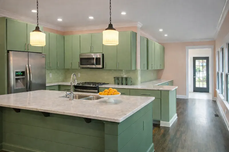 Professionally painted kitchen cabinets in Nashville — factory-smooth HVLP spray finish by Alan Robinson